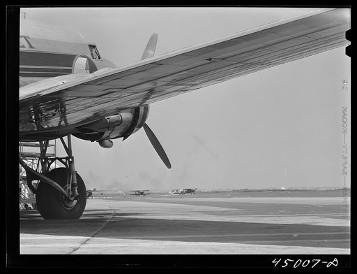 Untitled photo, possibly related to: An airliner taking on baggage and fuel. Washington, D.C. municipal airport