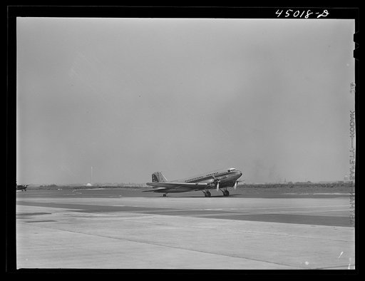 An airliner taxiing down the field. Washington.,D.C. municipal airport