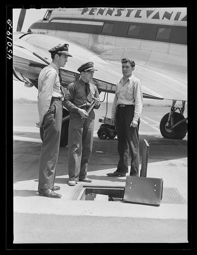 Untitled photo, possibly related to: Using the field phone which connects with the administration building. Washington D.C. municipal airport