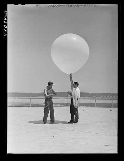 Untitled photo, possibly related to: Weather Bureau men preparing to send up the balloon for weather data. Municipal airport, Washington, D.C.