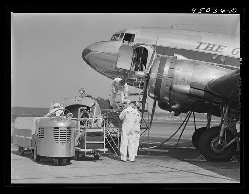 An airliner taking on baggage and fuel. Washington, D.C. municipal airport
