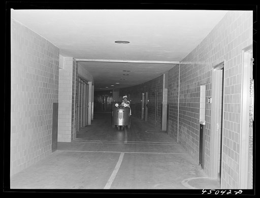 Untitled photo, possibly related to: The "tunnel," an underground passageway thru which all baggage and mail is handled. Municipal airport, Washington, D.C.