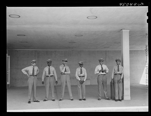 "Skycaps" at the entrance to the administration building. Municipal airport, Washington, D.C.