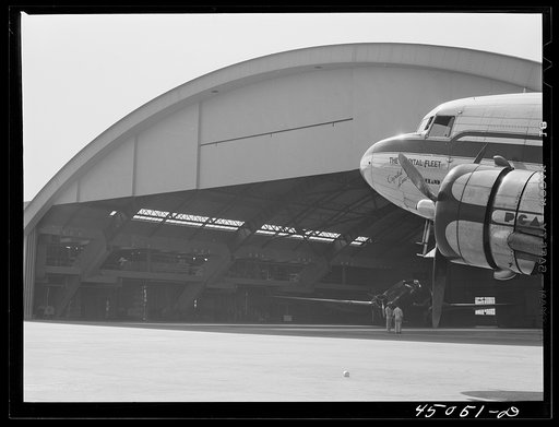 Untitled photo, possibly related to: A plane in front of the huge hangar. Municipal airport, Washington, D.C.