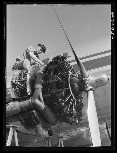 Working on an engine of one of the airliners. Municipal airport, Washington, D.C.
