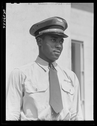 Untitled photo, possibly related to: "Skycaps" at the entrance to the administration building. Municipal airport, Washington, D.C.