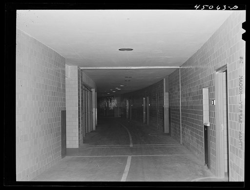 Untitled photo, possibly related to: The "tunnel," an underground passageway thru which all baggage and mail is handled. Municipal airport, Washington, D.C.