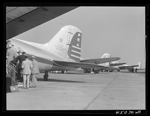 Passengers boarding an airliner. Municipal airport, Washington, D.C.
