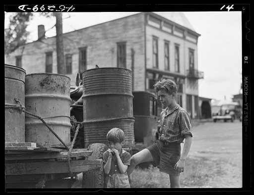 Two of the children of Mr. Earl J. Brown helping to get their last few belongings out of their farm in the Pine Camp expansion area. Pine Camp, New York