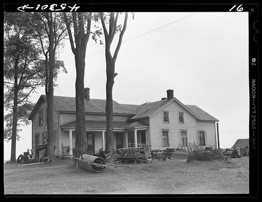 The O'Connell homestead in the Pine Camp expansion area. The articles outside the house are to be sold at auction in preparation for moving out of the area. Near Pine Camp, New York