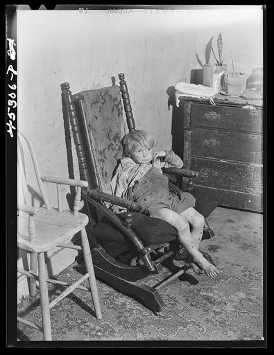 One of the children of Mr. and Mrs. Nelson Tousant. The Tousants are moving out of the Pine Camp expansion area after having lived there for seventeen years. Near Pine Camp, New York