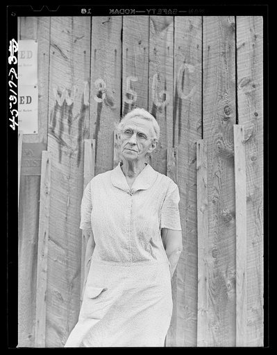 Mrs. Carrie Ward has lived near Leraysville for seventeen years. Now she is planning to move out of the Army camp area to a small farm in Sandy Creek. Her barn is numbered for auctioning. Leraysville, New York