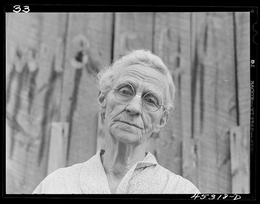 Mrs. Carrie Ward has lived near Leraysville for seventeen years. Now she is planning to move out of the Army camp area to a small farm in Sandy Creek. Her barn is numbered for auctioning. Leraysville, New York