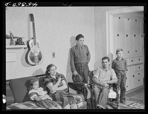 The family of Gottlieb Zahler in their new farm in Lacona, New York, to which they moved from the Pine camp relocation area. In their new home in Lacona, New York