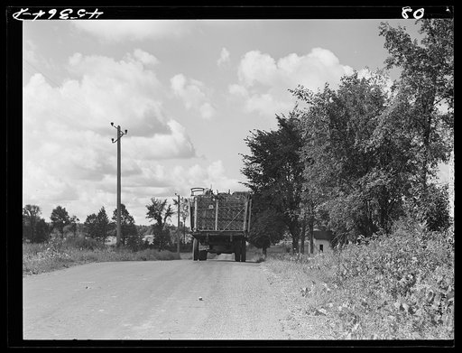A truck on the road in Pine camp expansion area moving out a family's belongings. New York
