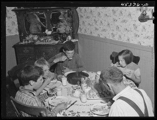 Having dinner at the home of Ray Lyman, FSA (Farm Security Administration) client near Castleton, Vermont