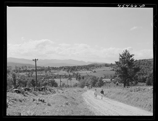 Vermont tourists taking a walk along a county road near Mount Holly, Vermont