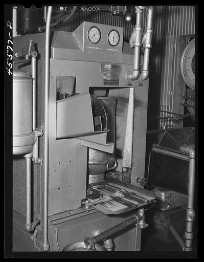 The can washing machine in the Burlington cooperative milk bottling plant. Burlington, Vermont