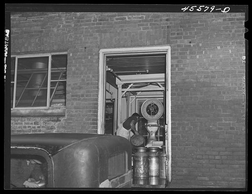 Untitled photo, possibly related to: Weighing milk at the Burlington cooperative milk bottling plant. Burlington, Vermont