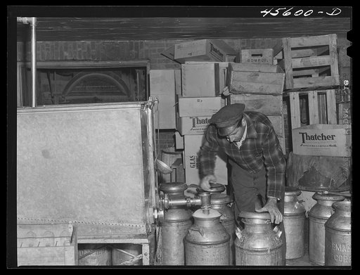Untitled photo, possibly related to: Milk cans at the United Farmers' cooperative creamery