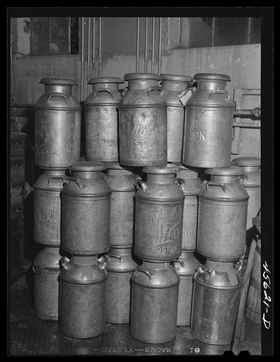 Untitled photo, possibly related to: Farmer getting his empty milk cans back at the Burlington cooperative milk bottling plant. Burlington, Vermont