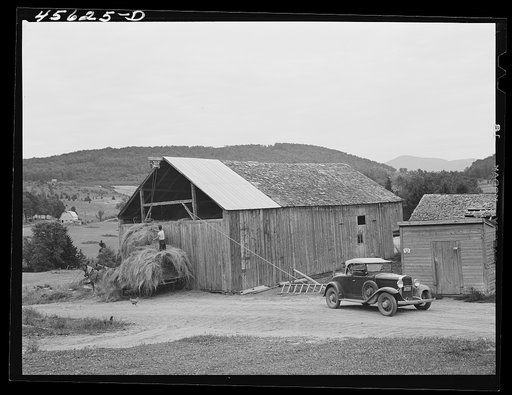 Using a car to load hay in the barn on a farm near Cambridge, Vermont