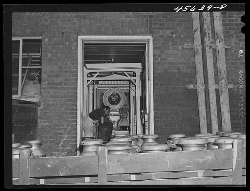 Untitled photo, possibly related to: Weighing milk at the Burlington cooperative milk bottling plant. Burlington, Vermont