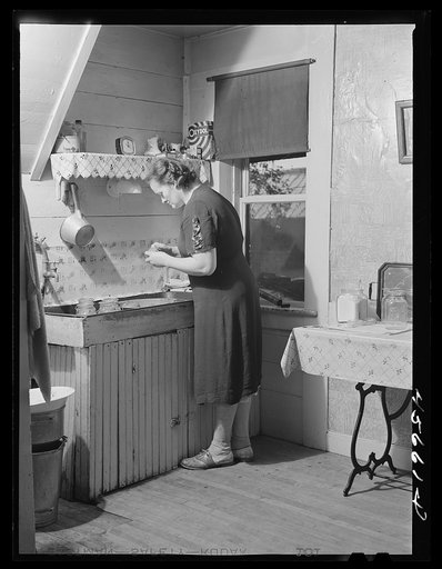 Mrs. W. Gaynor canning tomatoes on their farm near Fairfield, Vermont
