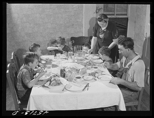 The Gaynor family at dinner on their farm. Fairfield, Vermont