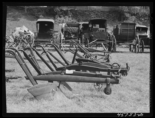 Exhibit of old ploughs and antique buggies at the World's Fair at Tunbridge, Vermont