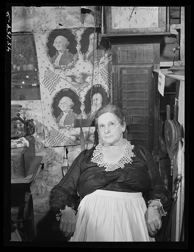 Mrs. H.H. Morey of Chelsea, Vermont, at the millinery and dressmaking exhibit in the antique building at the World's Fair. Tunbridge, Vermont