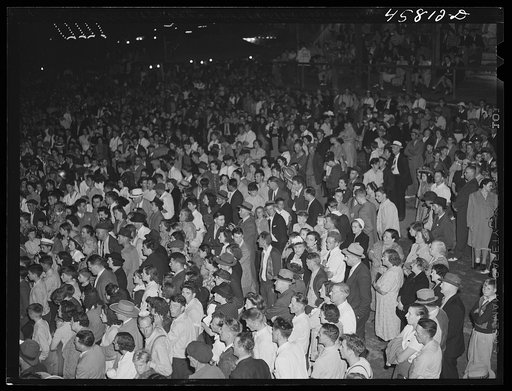 Untitled photo, possibly related to: Spectators in the grandstand watching the vaudeville act at the World's Fair. Tunbridge, Vermont