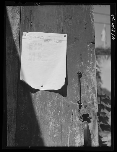 Program for the World's Fair posted on the door of the antique building. Tunbridge, Vermont