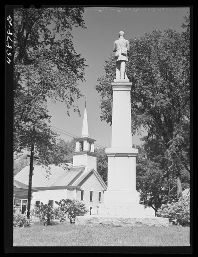 Untitled photo, possibly related to: Tunbridge, Vermont. Monument and a church