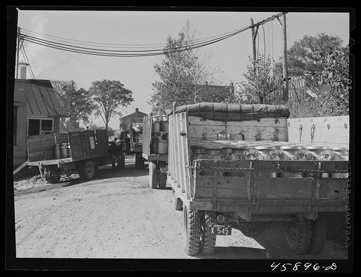 Untitled photo, possibly related to: Truck load of milk cans at the United Farmers' Co-op Creamery, East Berkshire, Vermont