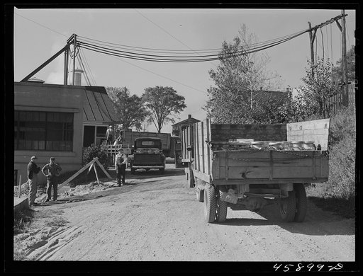 Untitled photo, possibly related to: Truck load of milk cans at the United Farmers' Co-op Creamery, East Berkshire, Vermont