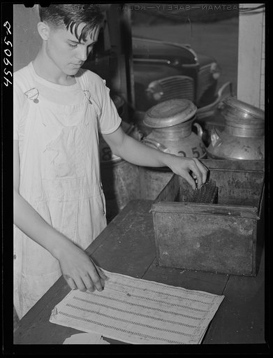 Untitled photo, possibly related to: Recording the weight of milk at the United Farmers' Co-op Creamery in East Berkshire, Vermont