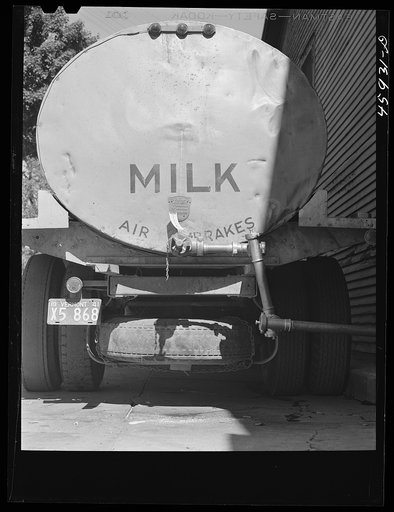 Untitled photo, possibly related to: Milk truck in front of the New England Dairies in Enosburg Falls, Vermont