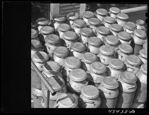 Untitled photo, possibly related to: Milk cans at the United Farmers' Co-op Creamery in East Berkshire, Vermont