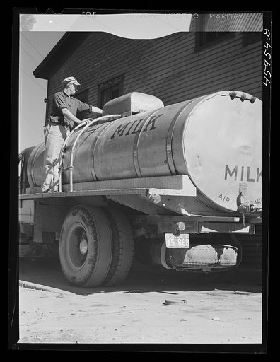 Untitled photo, possibly related to: Milk truck in front of the New England Dairies in Enosburg Falls, Vermont