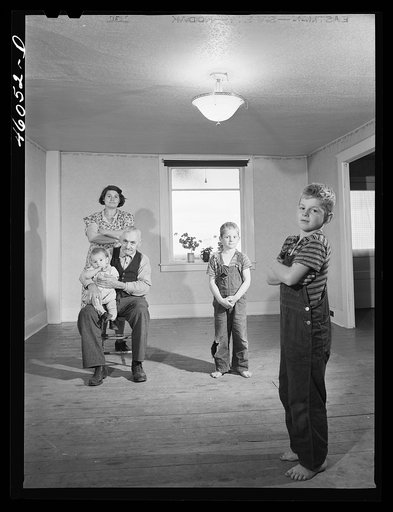 Mrs. Melvin Rivers, some of her children and her father-in-law in their new New York relocation corporation farm to which they have moved just recently, near Orwell, New York