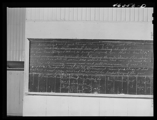 Abandoned schoolhouse (the Reedville School) in the Pine Camp expansion area which was attended by Dan Sampson's children. Inscription on blackboard was written by one of them. Near Sterlingville, New York