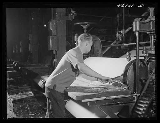 Pulling paper pulp off the rollers at the Mississquoi Corporation paper mill in Seldon Springs, Vermont