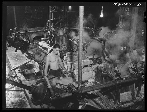 One of the machines that grinds wood into pulp at the Mississquoi Corporation paper mill at Sheldon Springs, Vermont