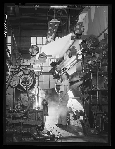 Section of a large rolling paper machine at the Mississquoi Corporation paper mill. Sheldon Springs, Vermont