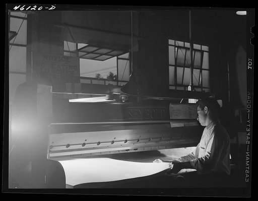 Untitled photo, possibly related to: Trimming paper at the Mississquoi Corporation paper mill in Sheldon Springs, Vermont