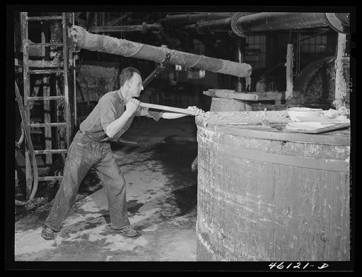 Stirring paper pulp in a large vat at the Mississquoi Corporation paper mill in Sheldon Springs, Vermont