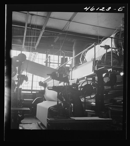 Untitled photo, possibly related to: One of the rolling machines in the Mississquoi Corporation paper mill. Sheldon Springs, Vermont