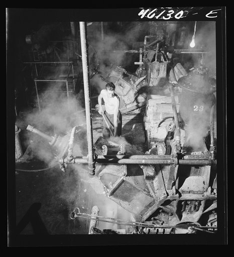 One of the last stages in making paper at the Mississquoi Corporation paper mill in Sheldon Springs, Vermont. One of the machines that grinds wood into pulp at the Mississquoi Corp Corporation paper mill, Sheldon Springs, Vermont