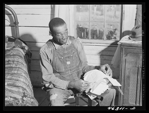 Penfield, Greene County, Georgia (vicinity). Illiterate FSA (Farm Security Administration) client who keeps his government letters neatly strung on a wire
